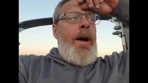 Kioti Tractor CK2610 moving Round Bales