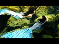 Two mermaid tails sparkle underwater beautiful underwater scenery with sparkly mermaids swimming