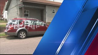 Detectives ask for help to figure out who spray painted racial slurs on homes and vehicles