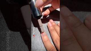 Applying Purple Color Nail Polish