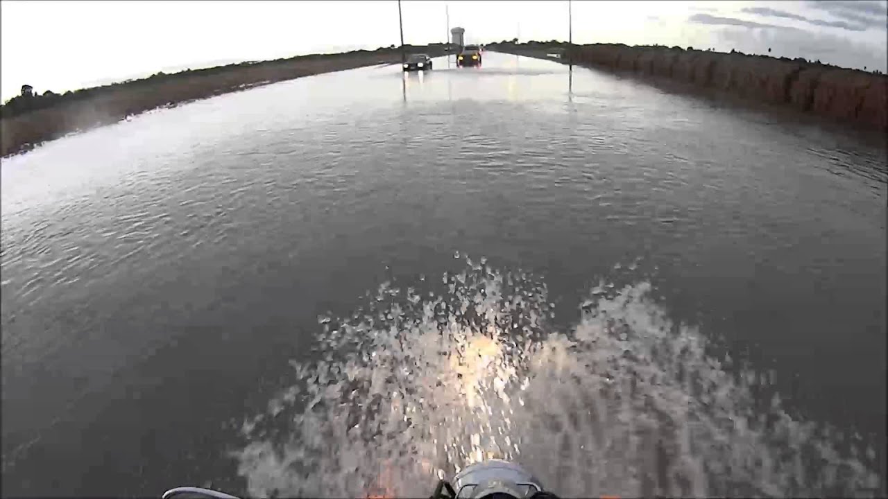 Riding motorcycle through flood water. YouTube