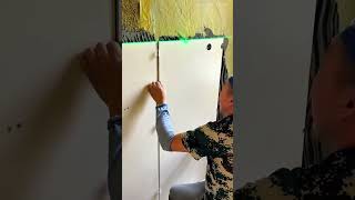 installing large white wall tiles using adhesive mortar and laser level alignment tool