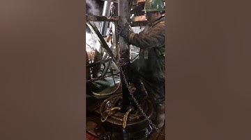 Making a spinning chain connection on an oil drilling rig Alberta Canada