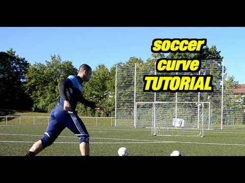 How do you kick a curve soccer ball?