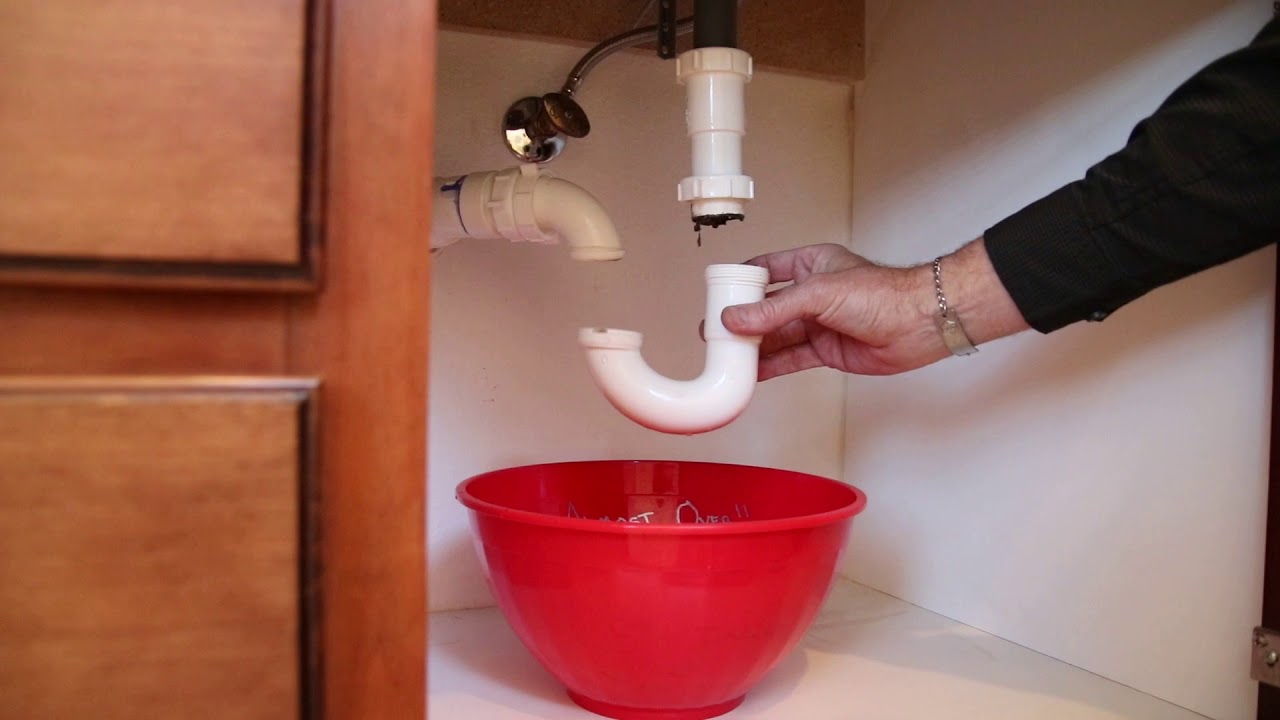 unclogging a kitchen sink pipe