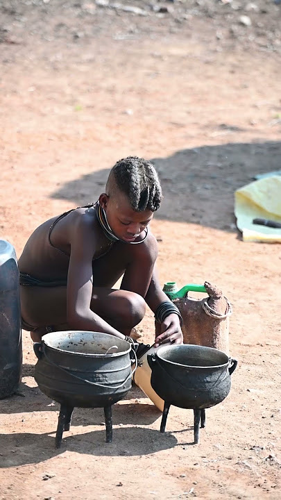 Girl from Himba tribe helps to do chores #himba #africa #namibia #tribe #tribal #tribes #triballife