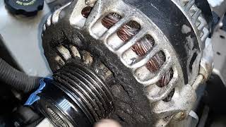 Rare failure of alternator pulley causes belt to break.