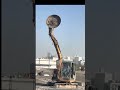 The circular iron disc rotating on the excavator's hydraulic breaker
