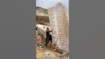 Stone Splitting Secrets: How Workers Divide Massive Rocks with Precision