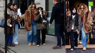 Jennifer Lopez hugs child Emme while bundled up with family on Christmas Eve shopping trip in Aspen