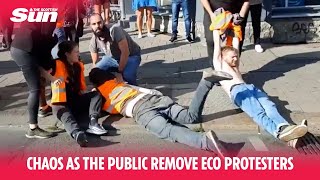 Chaos as the public deal with eco-protesters blocking road