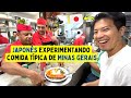 Japonês experimentando comida típica de Minas Gerais