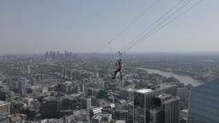 BBC reporter zip lines between London skyscrapers