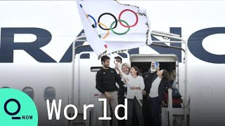 Olympic Flag Arrives in France From Tokyo Ahead of 2024 Games in Paris