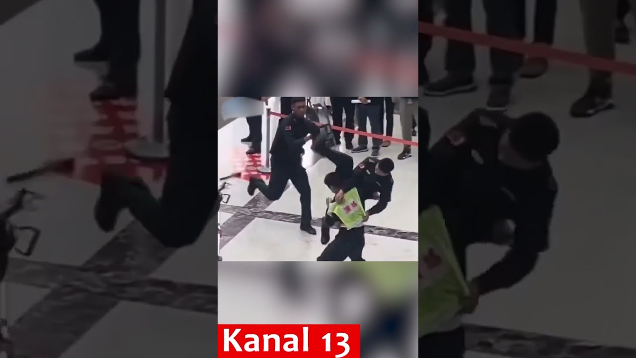 Chinese Police Officer Subduing A Criminal During Raid