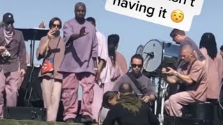 kanye west protects his daughter north from creepy photographer at sunday service