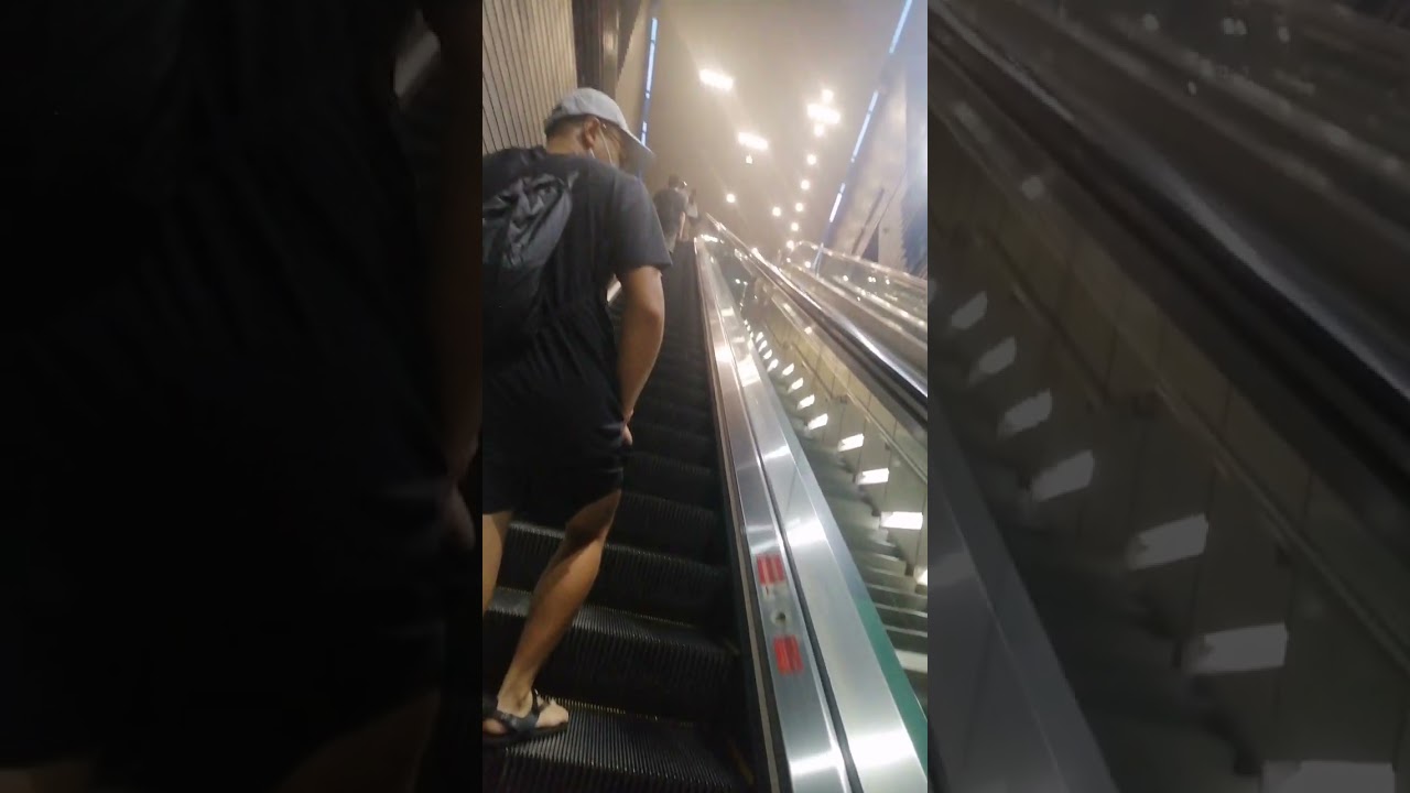 Riding escalator at national stadium Singapore 