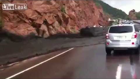Mudslide carries car away - video from the car and from bystander