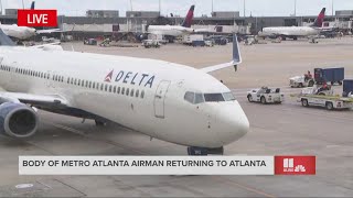 Plane carrying US airman's body arrives in Atlanta