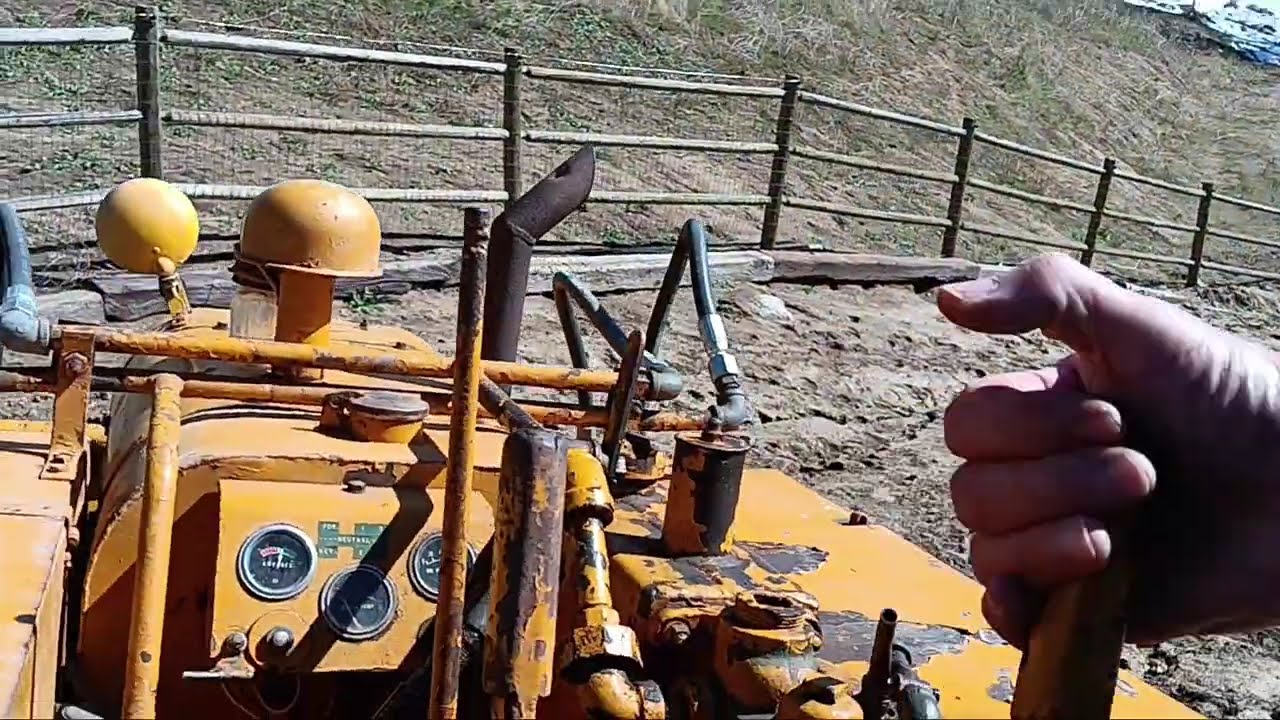CLARK AIRBORNE DOZER GOING DOWN STEEP HILL AND THEN THE DUMMY OPERATOR RUNS OUT OF FUEL