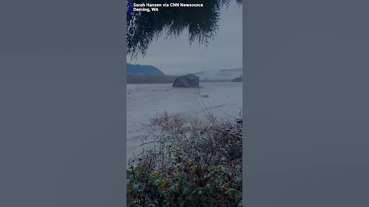 House floating down river after flooding