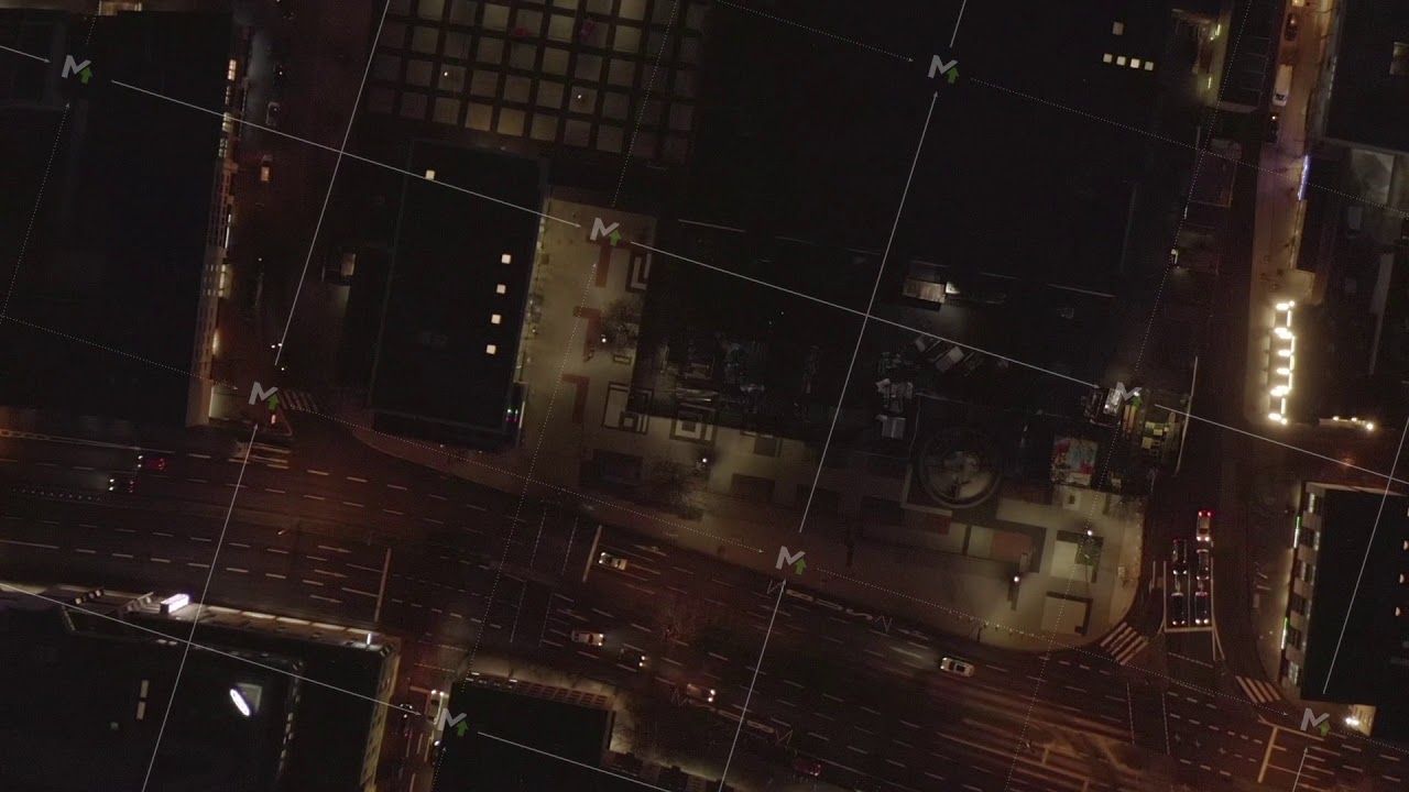 AERIAL: Slow Overhead Shot of City at Night with Lights and Traffic, Cologne, Germany