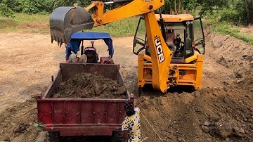 Backhoe Machine Loading Soil In Tractor Video