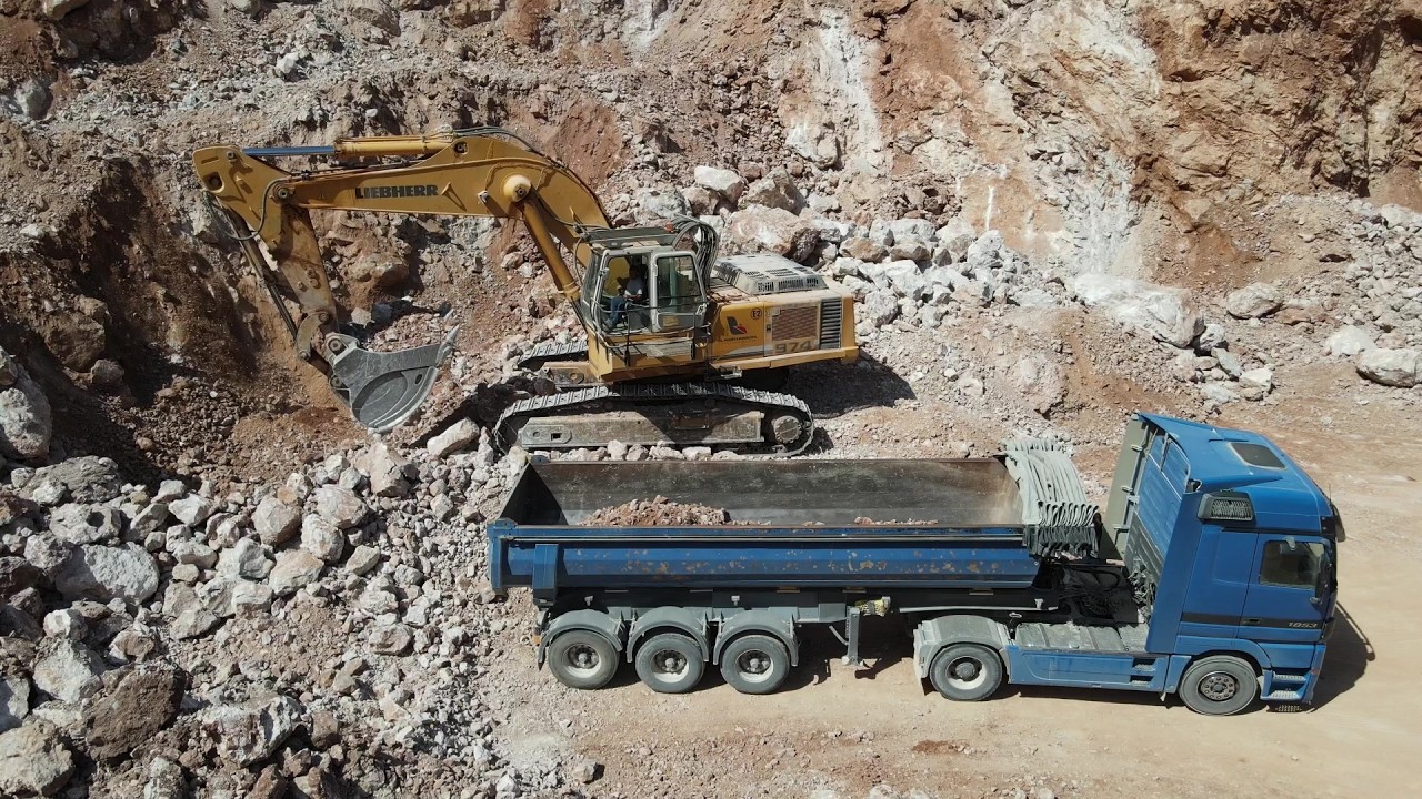 Drone View: Liebherr 974 Excavator Loading Trucks At Aggregate Quarry - Sotiriadis/Labrianidis