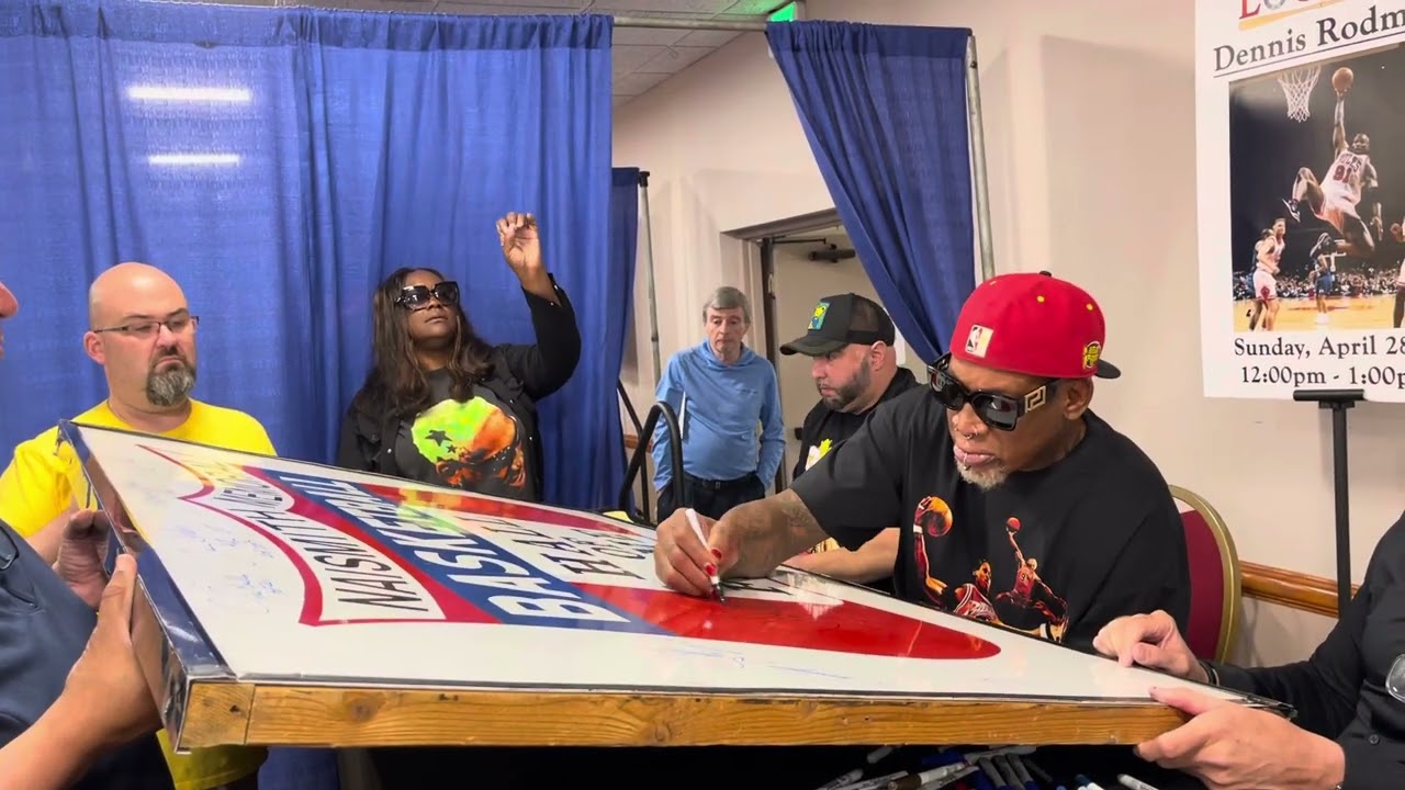 NBA Legend and Hall of Famer Dennis Rodman signs the original basketball Hall of Fame sign.