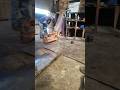 SLAMMING WITH HEAVY HAMMER IN MECHANICAL WORKSHOP DURING EXCAVATOR'S END BOSS REPAIR
