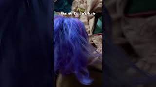 Fixing Dawn’s hair