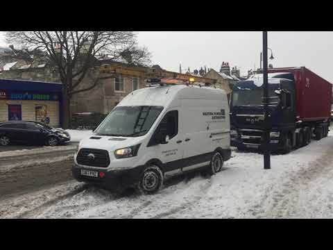 Ford transit 4x4 pulls truck In Snow