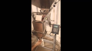 Logical Machines S-4 Weigh-Fill Machine Running 6 oz. Cinnamon Covered Almonds