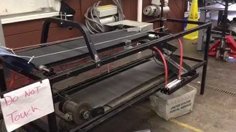 Conveyor System with Pnuematic Can Crusher