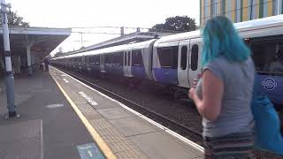 Elizabeth Line train arriving at and departing from Forest Gate