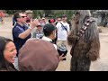 A man talking to Chewbacca in Wookiee language
