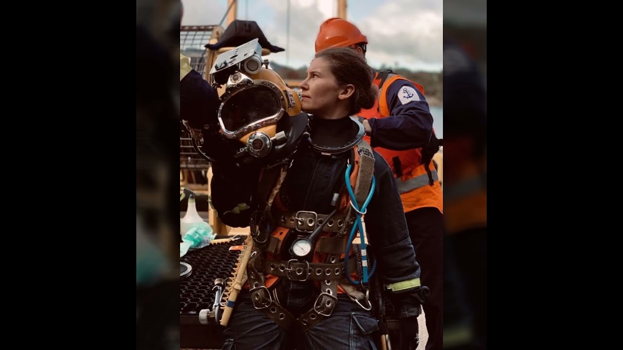 Attentive woman of 2027 in latexfull facegas masks and scuvadiving geardresses