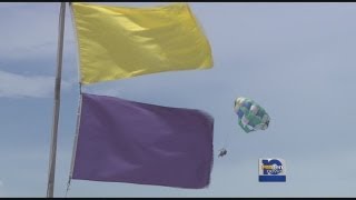Yellow purple flags fly at Gulf