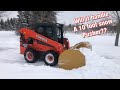 Snow Plowing with a Kubota SSV-65 using a 10 foot snow pusher!