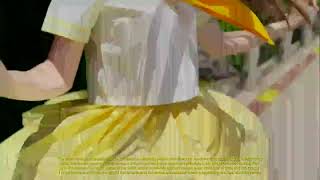 A charming girl in a yellow chick costume runs on a wooden bridge in a lush park
