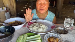 Eating fried meat with fresh cucumber, boiled vegetable, chutney and pickle| local food|