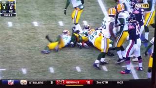 Joe Thomas #48 knocks sticker off Ka'Deem Carey #25 Bears helmet