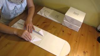 Packing a foldable magnetic rigid box