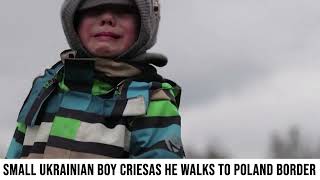 Small Ukrainian boy cries as he walks to Poland border