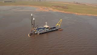 Cutter suction dredger mining sand for nearby road construction project