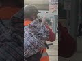 Motorcyclist Comforts Live Turkey Passenger