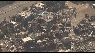 HOMELESS ENCAMPMENT CLEANUP:  Workers begin the process of clearing out a massive Oakland homeless e