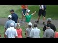 Kid celebrates Rory McIlroy giving him a golf ball at BMW
