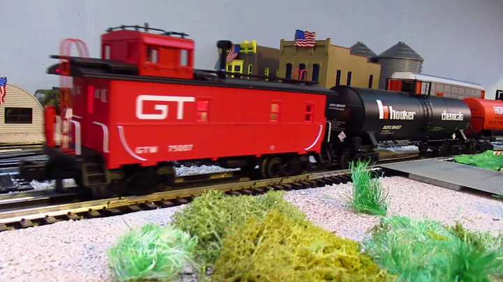 AMTRAK TurboTrain and Grand Trunk Western freight train in O Scale 3-rail.