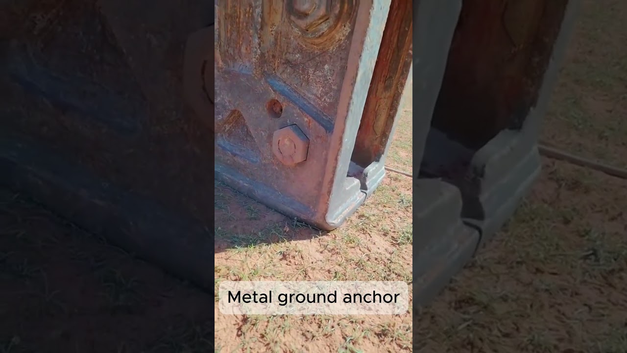 Metal ground anchor positioned for structural support  